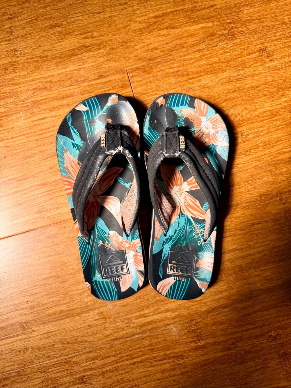 Reef Kids Floral Flip-Flops in Teal, Black, and Coral